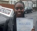 Henriquetta with Driving test pass certificate